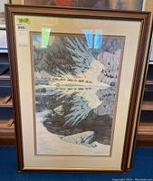 Full view of framed print showing snowy mountain landscape with horses; wood-tone frame and double mat