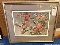 Framed print front view showing gold-tone frame, grey mat, cardinal and apple artwork