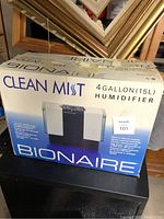 Photo of the Bionaire Clean Mist humidifier box showing the brand, model, and 4 gallon capacity