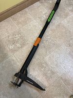 Full view of Fiskars weed extractor showing handle and prongs