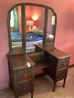 Full view of the antique low vanity dresser showing the central three-piece mirror and two drawer pedestals.