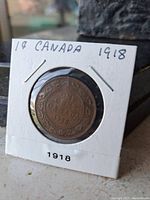 Reverse side of the 1918 Canadian large one cent coin showing the wreath design and denomination details.