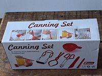 Photo of the closed box showing 'Canning Set' title and images of the included 6 pieces tools on the box front.