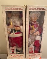 Boxed Santa Claus animated figure holding a candle, from the Motion-ettes of Christmas series by Tulio. Shows packaging and figure details.