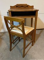 Wooden vintage writing desk with small hutch and matching chair showing front and side details