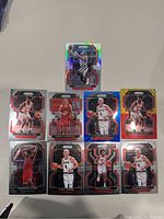 Nine Chicago Bulls NBA trading cards displayed on a white surface, showing holographic and colored borders with player images and names.