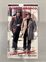 Front cover of Donnie Brasco VHS tape with image of Al Pacino and Johnny Depp.