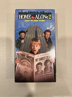 Front view of the VHS cover showing Kevin McCallister and the Wet Bandits with the New York skyline.