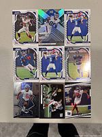 Front view of 9 New York Giants football trading cards showing various players.