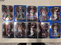 Group photo of 11 Panini Prizm NBA cards featuring New York Knicks players and others, laid out on a light surface.