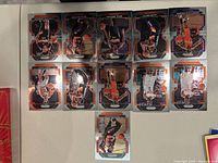 Photo of 11 Phoenix Suns basketball trading cards laid out in two rows and one card centered below.