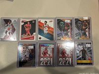 Nine Scottie Barnes rookie basketball cards in protective sleeves/holders, showing player in various poses and card styles.