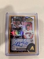 Close-up of Stuart Fairchild Topps Gold Label rookie baseball card showing front with autograph and images in Arizona Diamondbacks uniform.