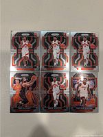 Six NBA trading cards featuring Toronto Raptors players and one Miami Heat player on a plain background