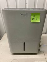 Front view of the Soleusair dehumidifier showing the brand logo and vertical water level window.