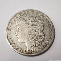 Obverse side showing Lady Liberty with E PLURIBUS UNUM and 1889 date.