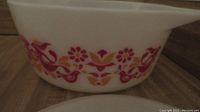 Close-up of medium Friendship pattern bowl showing pink and orange birds and flowers motif