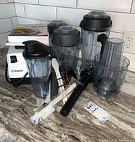 overview of motor base, containers, accessories and cookbooks