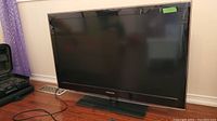 Front view of Samsung flat screen TV showing the screen and base stand, tagged with '40' indicating screen size.