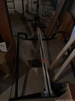 Full view of Versaclimber showing frame, pedals, and handles in basement setting