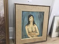 Full frontal view of framed nude woman painting signed Stanios 1971 with title at top.