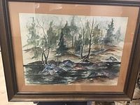 Overall view of framed watercolour painting showing landscape with trees and rocks.