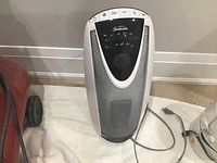 Front view of the Sunbeam swivel heater showing the unit's overall design and cord placement.