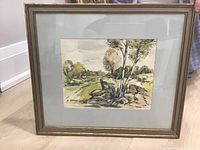 Overall view of the framed watercolour landscape painting showing artwork, mat, and frame.