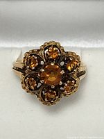 Front view of ring showing central and surrounding citrine stones
