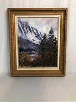 Full front view of framed oil painting of mountain and lake landscape, showing overall condition and frame details.