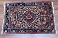 Full view of the rectangular rug showing overall pattern and condition.