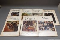 All seven art print books are laid out with covers visible showing various famous paintings by Gauguin, Goya, Bruegel, Rubens, Toulouse-Lautrec, Cezanne, and Manet.