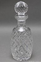 Full view of Waterford cut crystal decanter showing diamond cut pattern and the stopper on top