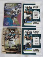 Four Philadelphia Eagles football cards showing players A.J. Brown, Miles Sanders, and two Season Ticket cards of Jalen Hurts with stats and team colors.