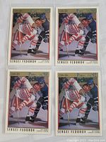 Four Sergei Fedorov rookie hockey cards in protective sleeves in a single photo.