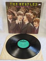 Vinyl record disc with teal Capitol label placed out of original sleeve.
