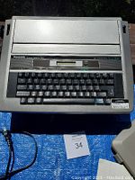 Top view of vintage Panasonic electric typewriter showing keyboard and brand label.