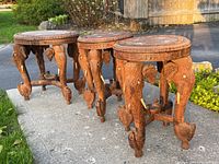 Three tables grouped at slight angle on driveway.