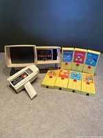 Full lot view - handheld movie viewer, viewing screen, 7 reels with story illustrations