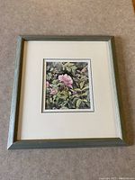 Front view of framed original watercolour artwork titled 'Nootka Rose' showing the entire frame and matting with the painting centered.