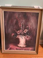 Framed canvas painting of floral still life with pink flowers and cactus in a white vase