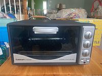 Front view of Cuisinart Classic toaster oven broiler with control knobs and glass door.