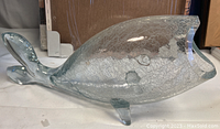 Side view of the clear crackle glass fish whale sculpture showing open mouth and crackle texture