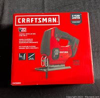 Front of sealed red box showing Craftsman V20 cordless variable speed jigsaw with 3 year limited warranty sticker
