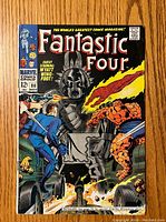 Front cover of Fantastic Four comic issue #80 showing characters and robot illustration.