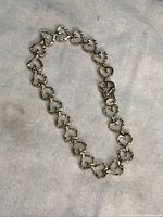 Full view of bracelet laid flat on fabric background