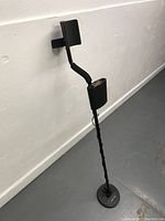 Full view of Bounty Hunter Fast Tracker metal detector standing upright, showing adjustable wand and handle.