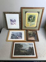 All four framed prints displayed on a white surface.