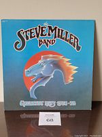 Front cover of The Steve Miller Band Greatest Hits 1974-78 vinyl album shows stylized horse graphic and band title.