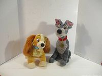 Front view of Lady and Tramp plush stuffed animals sitting side by side against a white background.